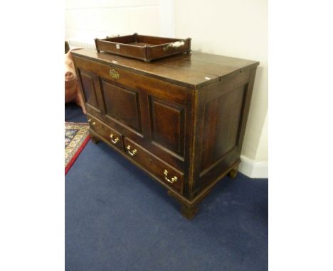 A GEORGIAN OAK MULE CHEST, with triple framed panel and two lower drawers on bracket feet supports, approximate size width 12