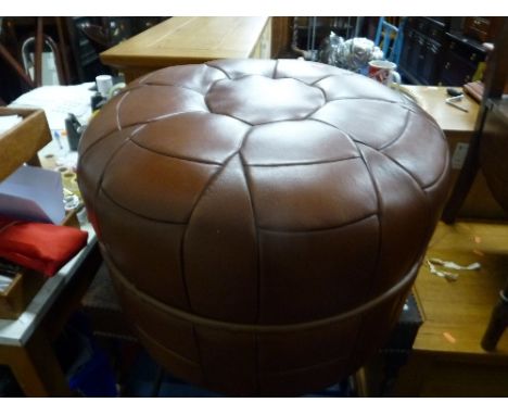 A BROWN LEATHER CIRCULAR POUFFE