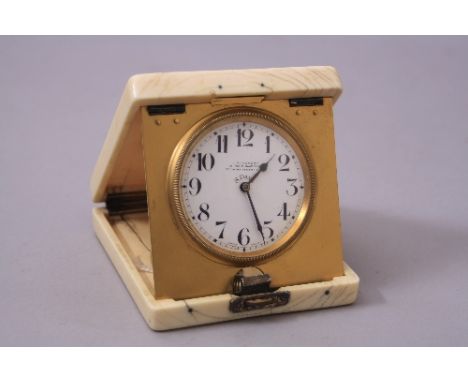 A TRAVELLING CLOCK, by J C Vickery in an ivory case