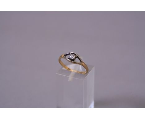 AN EARLY 20TH CENTURY SINGLE STONE DIAMOND RING, one old cut diamond rub-over set in open marquise shape design, estimated to