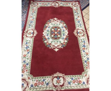 A TERRACOTTA GROUND RUG, approximate size width 241cm x depth 154cm, 'Kaleen Carpet Export Promotion Cancel, Indian label to 