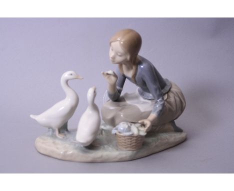 A LLADRO FIGURE GROUP, No.4849, girl feeding ducks with basket of vetetables