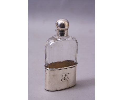 A SILVER BASED AND TOPPED GLASS FLASK