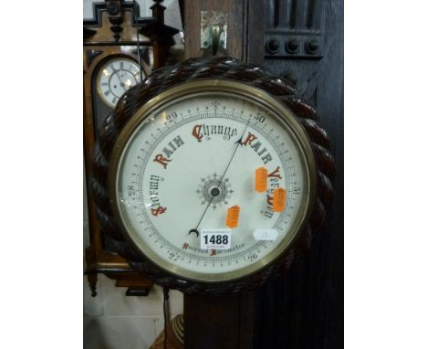 AN OAK ROPE TWIST CIRCULAR WALL BAROMETER