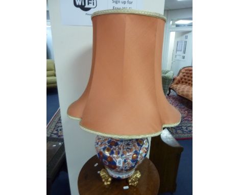 A CHINESE STYLE CERAMIC TABLE LAMP AND SHADE