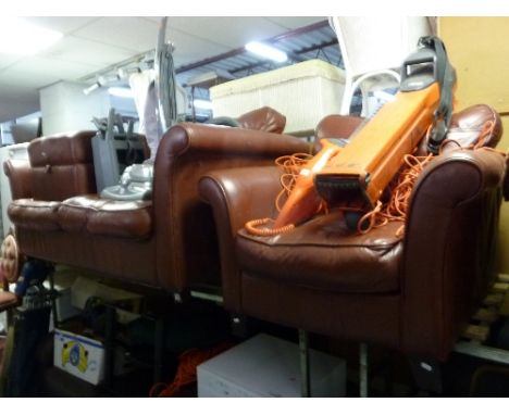 A BROWN LEATHER THREE PIECE LOUNGE SUITE, comprising of a two seater bed/settee, an armchair and a pouffe