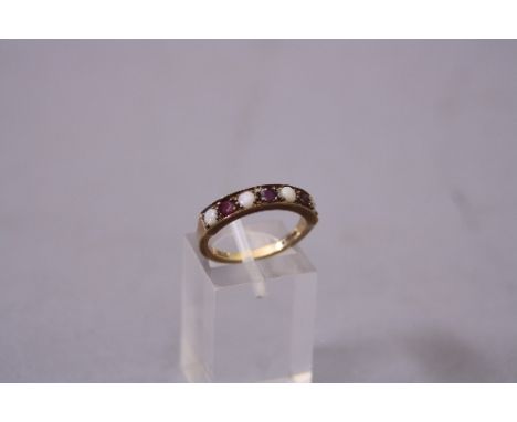 A LATE 20TH CENTURY 9CT GOLD OPAL AND GARNET HALF ETERNITY RING, ring size M, hallmarked 9ct gold, London 1975, approximate g