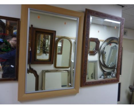 A MODERN WALL MIRROR, with floral embossed frame, approximate size 101cm x 70cm and another modern wall mirror with light oak