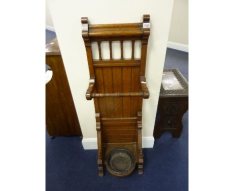 AN EDWARDIAN STICK/UMBRELLA STAND, with circular cast iron drip tray, approximate size width 33cm x depth 23cm x height 106cm