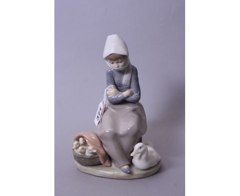 A LLADRO FIGURE GROUP, seated girl wrapped up against cold with mother duck and ducklings at feet