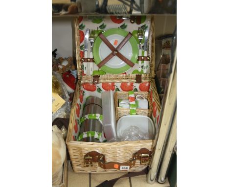 A WICKER PICNIC HAMPER