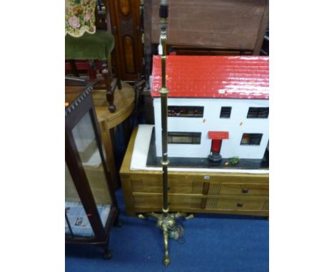 A BRASS TELESCOPIC STANDARD LAMP, with tripod base and shade