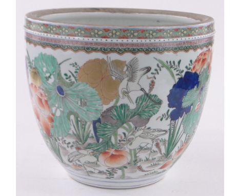 A Chinese porcelain jardiniere,painted enamel birds and foliage, height 32cm, diameter 38cm.