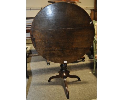 A George III oak tilt top tripod table,width 2'6, height 2'5".