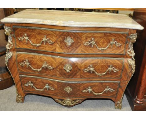 A French Kingwood marble topped Bombe commode in Louis XVI style,elaborate cast ormolu mouldings and mounts, width 3'7".