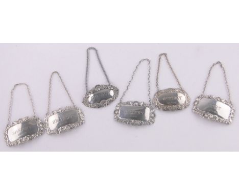 Collection of modern embossed silver decanter labels.
