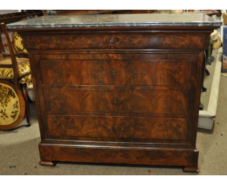 A 19th century flamed veneered mahogany French commode,with a white and grey veined marble top, barrel frieze drawers with 3 