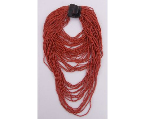 A Chinese multi-strand coral bead necklace,with horn clasp.