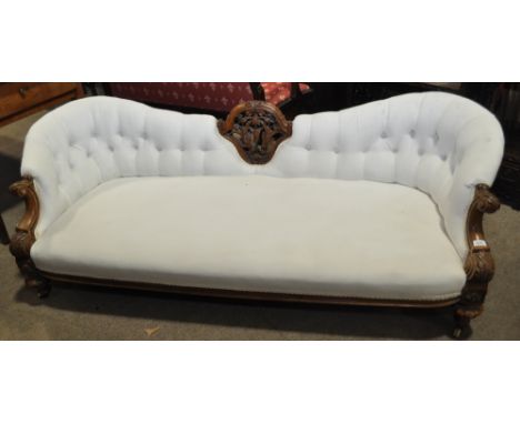 A Victorian button back upholstered bow end sofa,with carved walnut showwood, length 6', height 2', seat height 11".