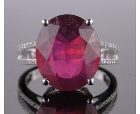 A 14ct white gold 8.35ct ruby ring,diamond set shoulders, ruby height 13mm, size M.