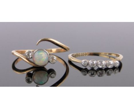 An 18ct gold opal and diamond crossover ring,and a 5 stone diamond ring, both a/f, (2).