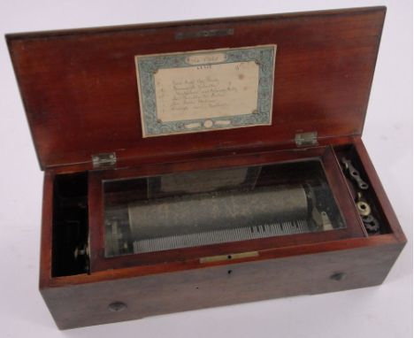 A 19th century Swiss walnut cased musical box,playing 6 airs on a 23cm cylinder, some teeth missing, case width 45cm.