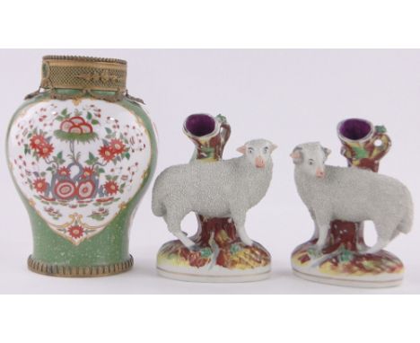 A pair of 19th century Staffordshire Pottery sheep spill vases,height 19cm and a 19th century transfer printed vase with gilt