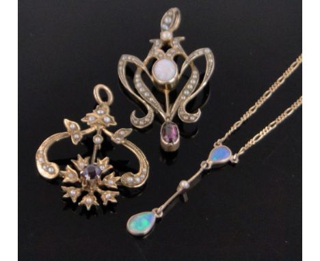 An Art Nouveau opal, garnet and pearl set open work pendant,unmarked gold settings, height 40mm, an amethyst and pearl set go