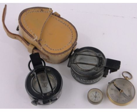 A Second War period military compass dated 1944,a J H Steward field compass with mother of pearl dial in leather case, and 2 