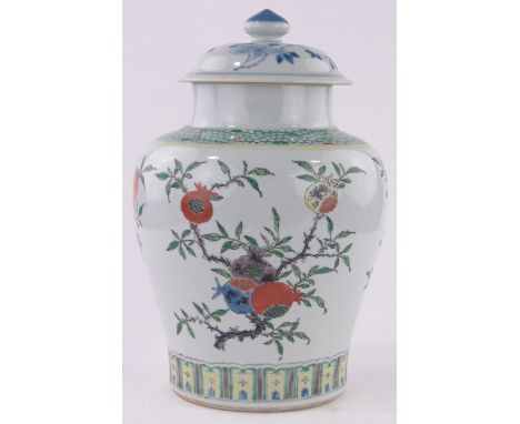 A large Chinese porcelain jar and cover,painted enamel pomegranate design, height 39cm.