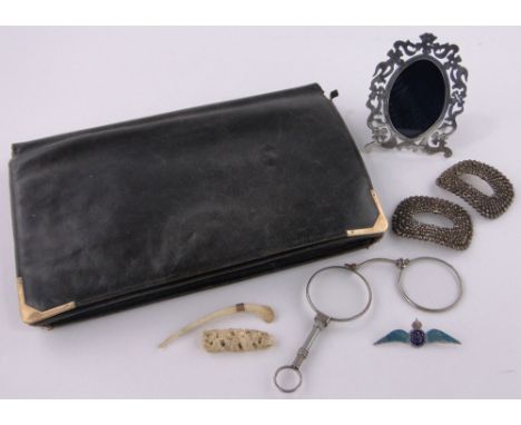 A Mappin & Webb leather bag with 9ct gold mounts,a continental pierced silver photo frame, silver and enamel RAF Wings brooch