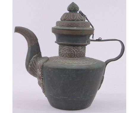 A 19th century Tibetan copper teapot,with relief embossed brass mounts, overall height 27cm.