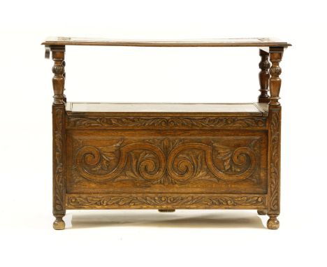 A 1920s oak monk's bench, 108cm wide, 50cm deep, 82cm high