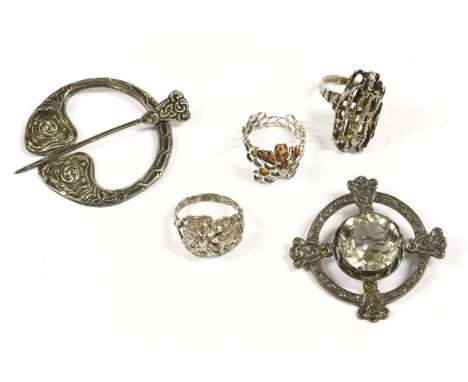 A collection of silver items to include a silver bark textured ring, marked London 1973, H.J., a silver ring in the form of a