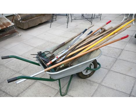 A collection of various elm handled vintage gardening tools and other similar