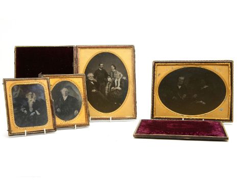 Four Victorian portrait photographs, including a family group, in three hinged gilt tooled leather cases, 23 x 18cm, and 15.5