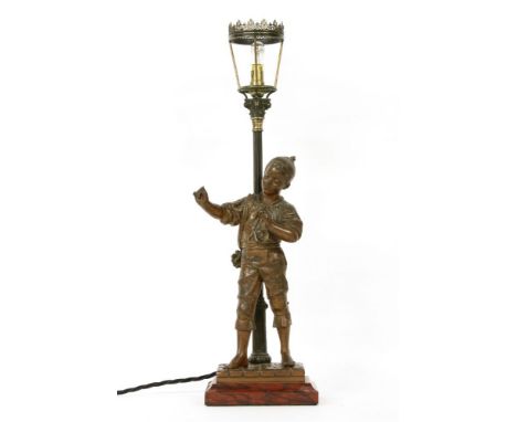 After Bouret, a bronzed lamp base in the form of a 'lighter boy', signed to the base and on stepped marble base