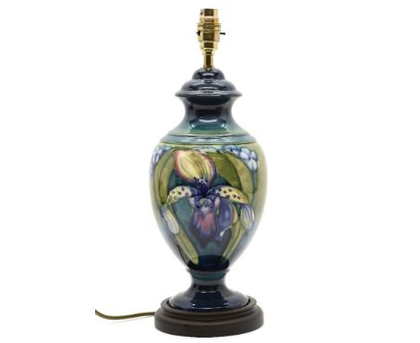 A Moorcroft Iris lamp base, on a plinth, 43cm high