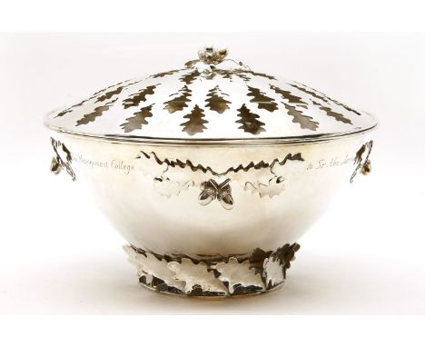 A modern silver pot pourri bowl and cover, decorated and pierced with oak leaves and acorns, by RCB, London 1989, with presen