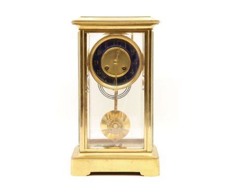 A 19th century French brass four glass mantel clock, with blue enamel chapter ring, striking on a gong. 34.5cm high