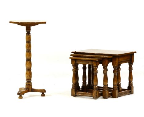 A nest of three reproduction oak tables, largest 54cm wide, 39cm deep, 44cm high and an octagonal lamp table