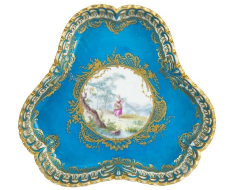 A SEVRES TREFOIL TRAY WITH SPURIOUS FACTORY MARK AND DATE, 18TH CENTURYof trefoil form with a pierced feather border, the tur