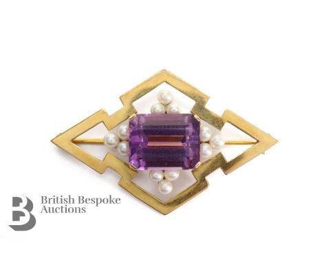 9ct Yellow gold and amethyst Cairncross bespoke&nbsp;brooch. The emerald-cut amethyst measures 15 x 12mm, set at each edge wi