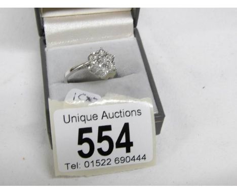 A white and yellow gold quarter carat floral diamond ring