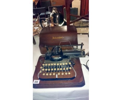 A Blickensderfer portable typewriter in wooden case
 
The carriage does move smoothly &amp; type wheel rotates, however atten