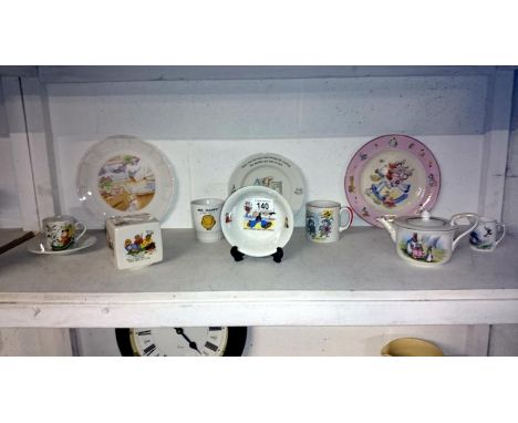 A collection of nursery ware including Grimwades Peter Rabbit teapot/milk jug, Sooty, Popeye etc