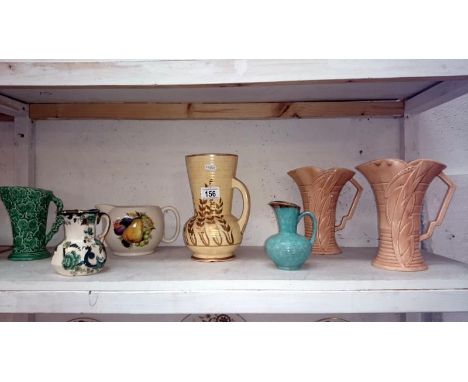 A shelf of jugs etc