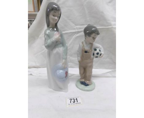 2 NAO figurines, girl with hat and boy with football