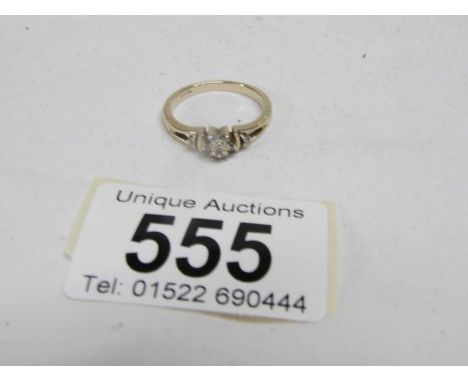 A 9ct gold ring with 2 diamonds on shoulders, size N