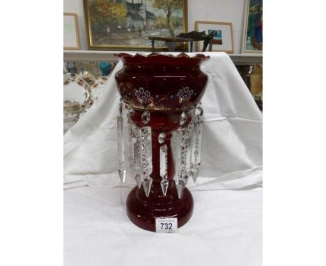 A Victorian hand decorated ruby glass table lustre